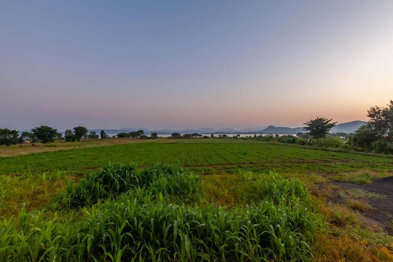 Stayvista's La Vie: Tranquil Lakeside With Pool And Farmland Views