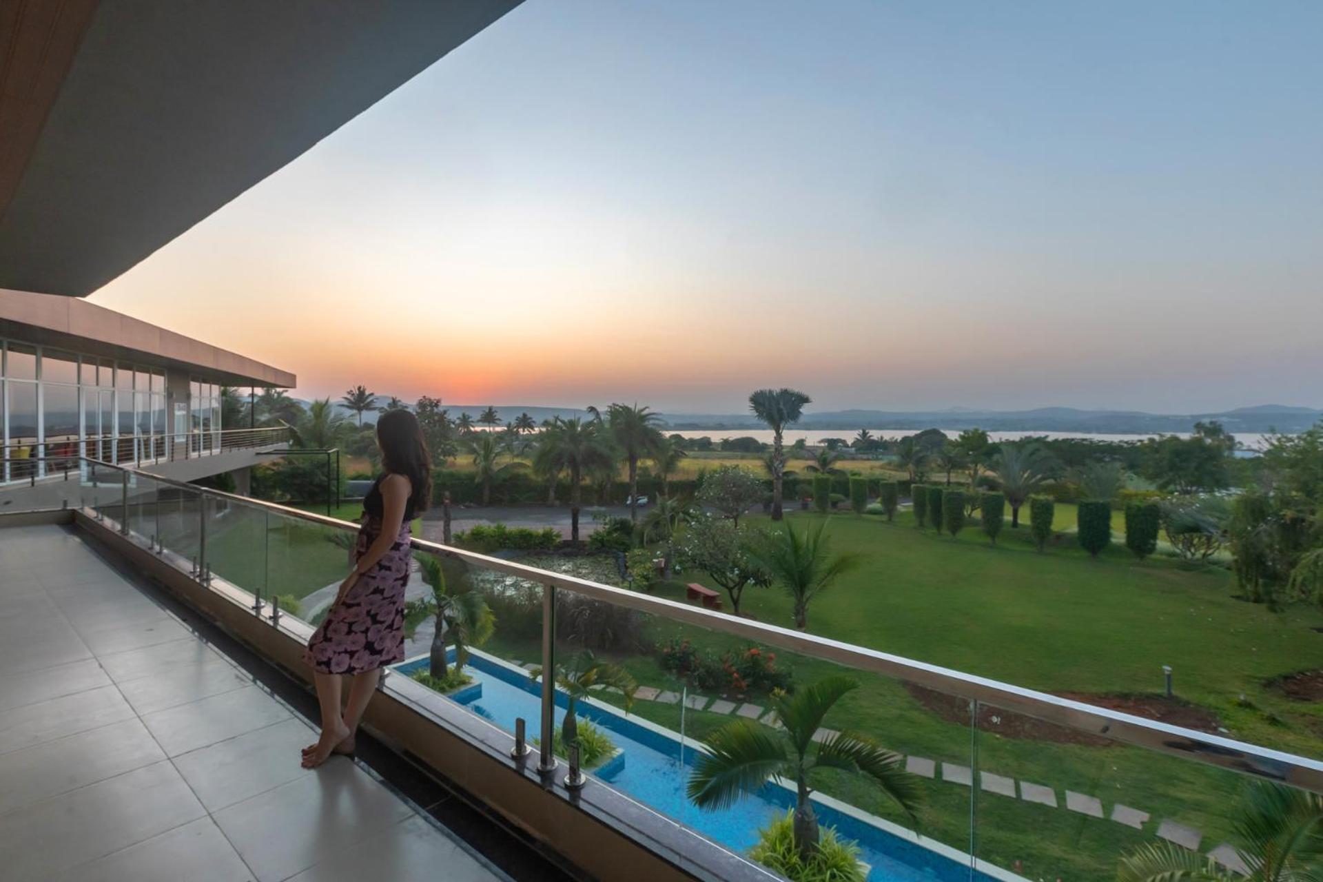 Stayvista's Watermark - Hillside Lakeview Retreat With Infinity Pool, Garden & Terrace - Near Nashik's Vineyard Haven