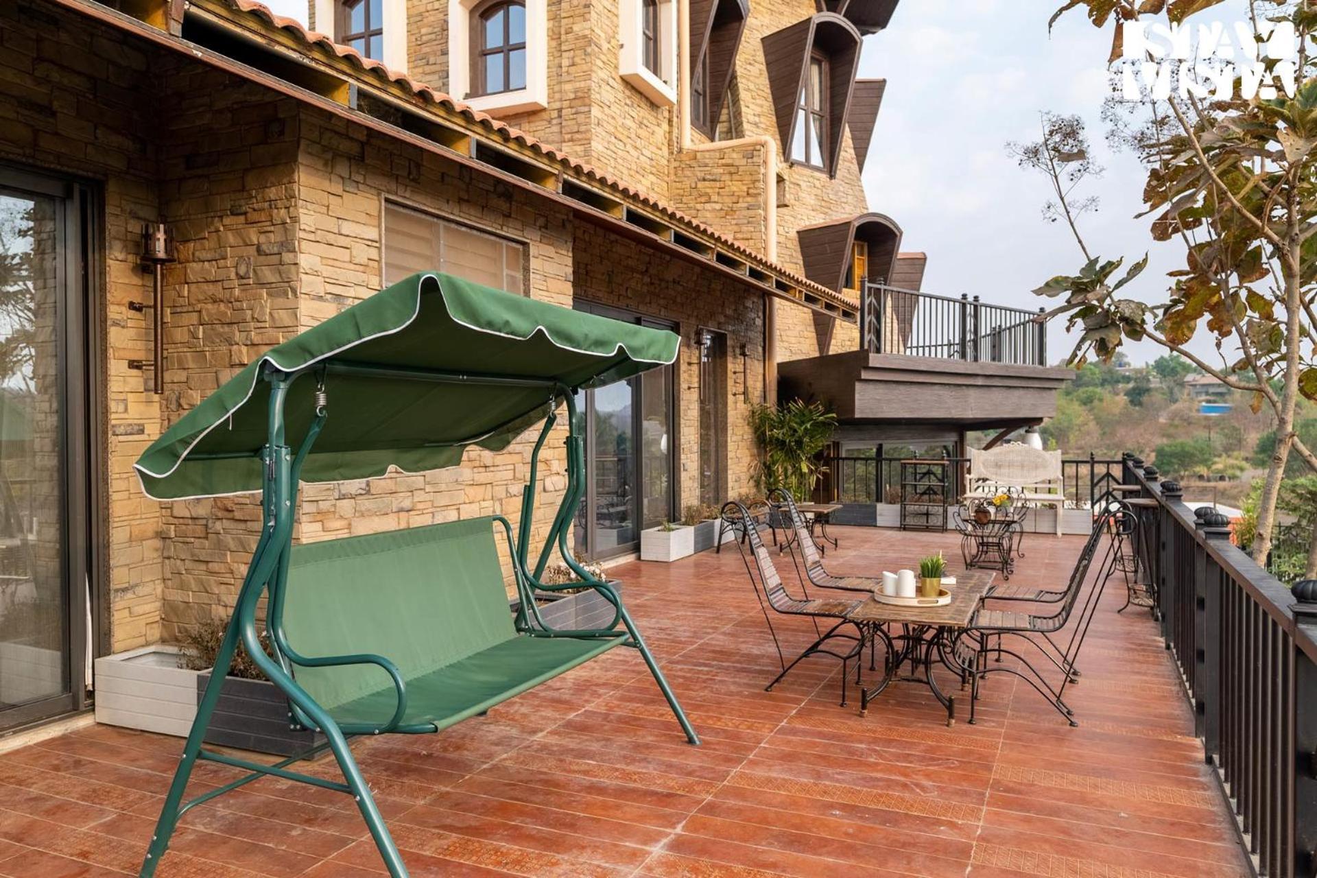 Villa Stayvista's Cerenity Castle - Lakeside Haven With Hill-view, Terrace & Indoor Entertainment Nashik