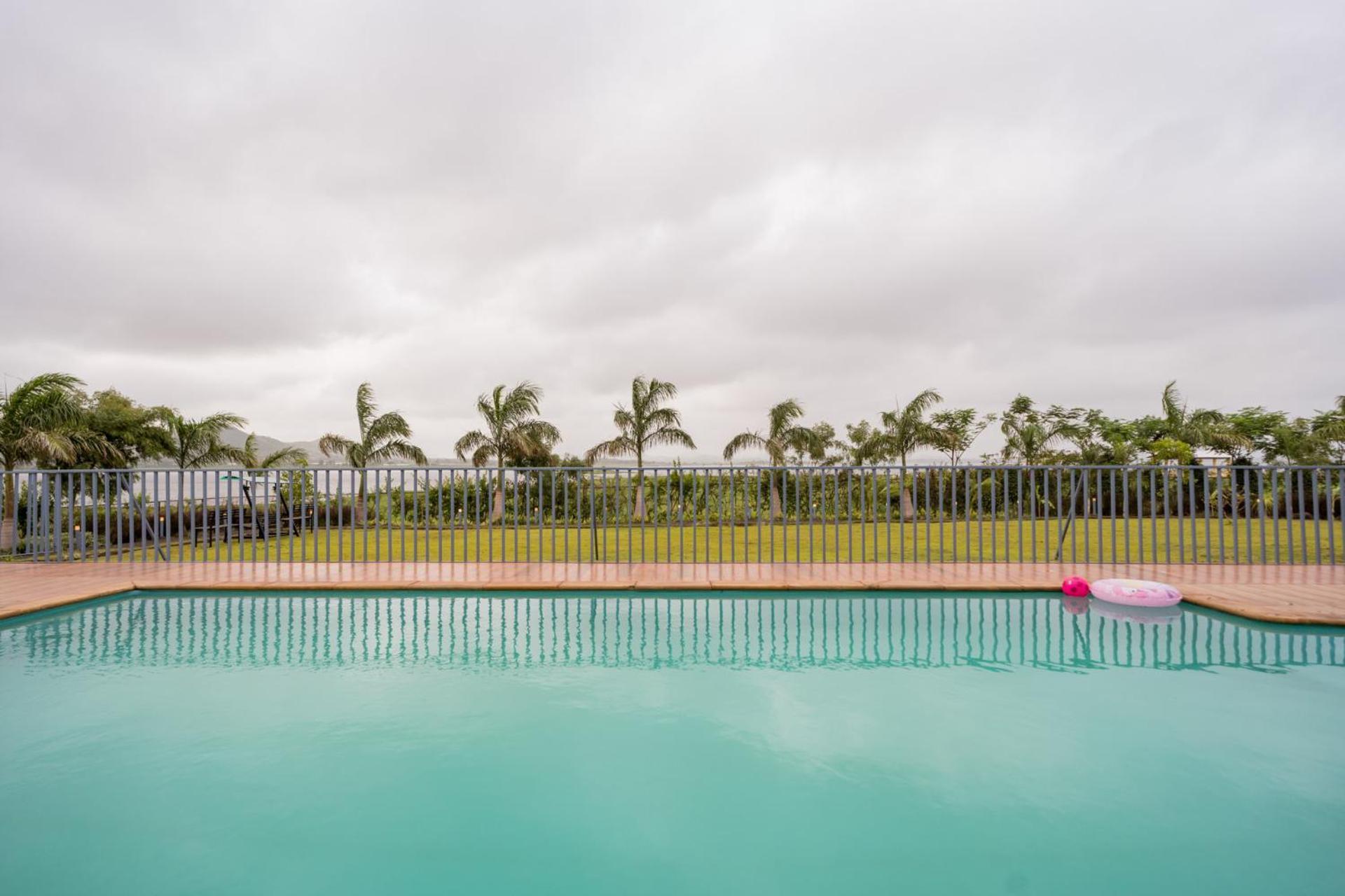 Villa Stayvista's Eva - Lakeside Luxury With Modern Decor, Pool & Expansive Lawn - Near Sula *