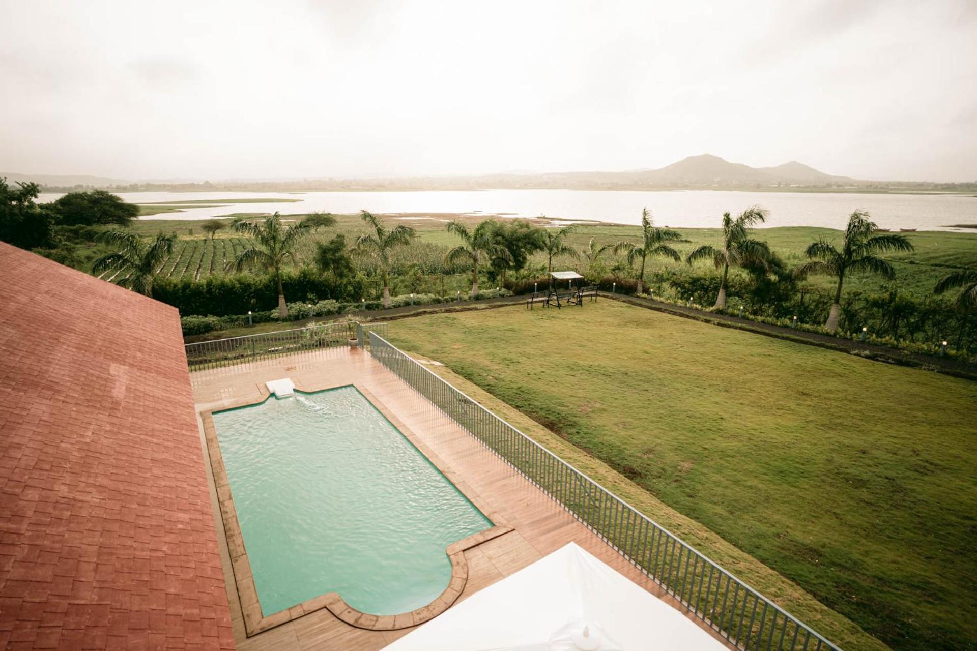 Stayvista's Eva - Lakeside Luxury With Modern Decor, Pool & Expansive Lawn - Near Sula Villa *